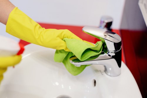 Professional cleaner working in a Kennington flat